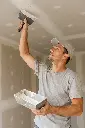 Drywall Finishing – Contractor Applying Joint Compound to Seams.webp